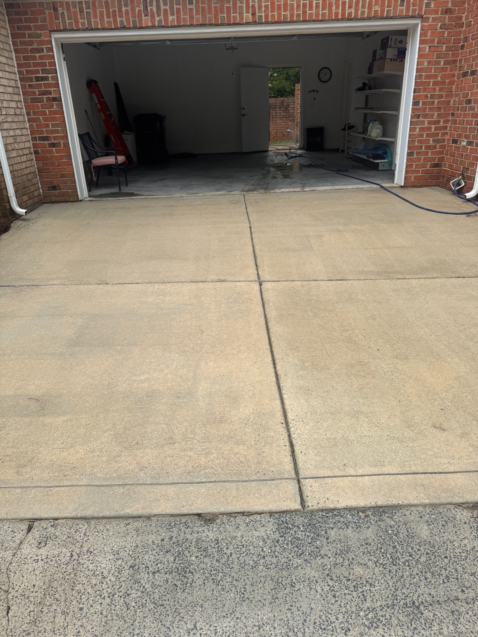 The same driveway after pressure cleaning